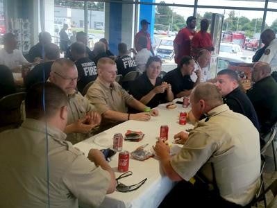 Team of Glen Sain Chevrolet GMC inc enjoying snacks and drinking Coca-Cola